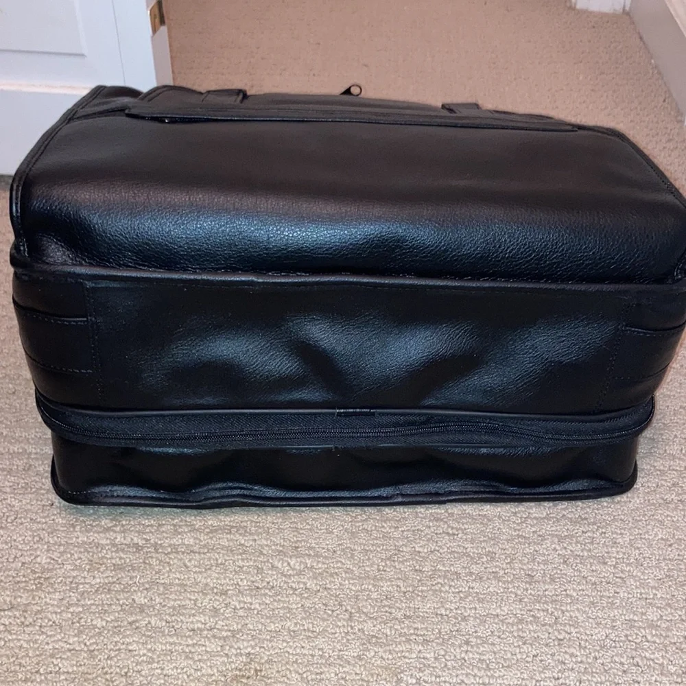 NWT black leather expandable multiple pockets with shoulder strap